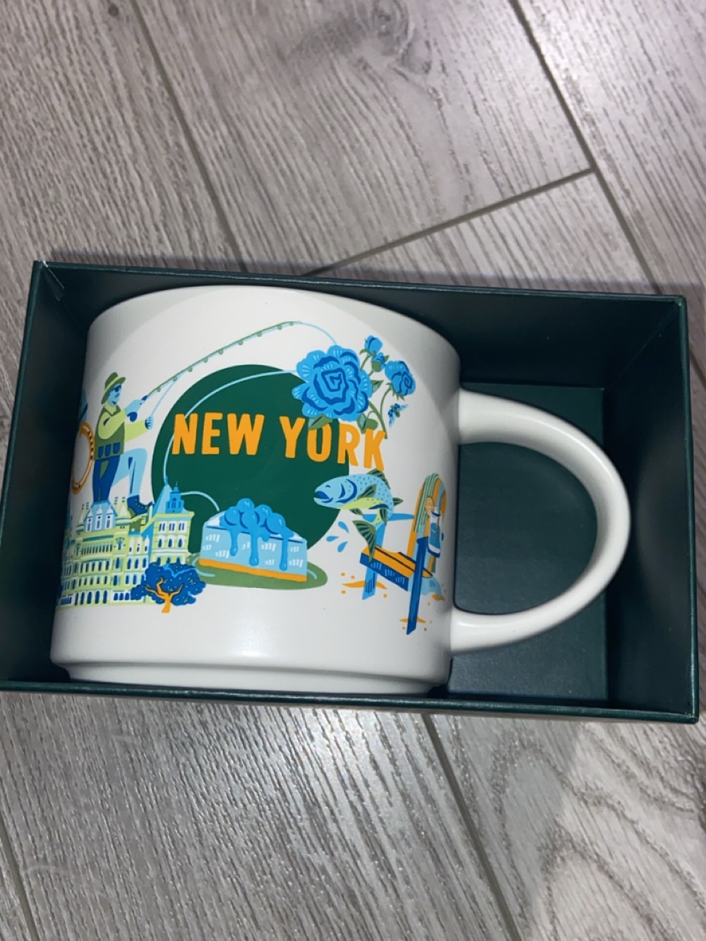 New York White Ceramic Souvenir Mug with Blue and Green Design